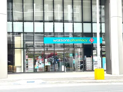 a building with a sign in front of a store at Elegant yet Affordable condo in Pasay in Manila