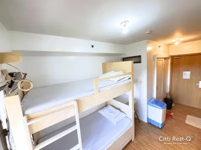 a room with two bunk beds in a room at Studio City Alabang Pool Access Free for 2 Wifi & Netflix SC4 in Manila