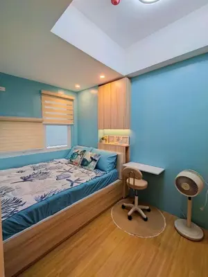 a bedroom with a bed and a desk and a chair at Cozy place near pavilion mall and Sm starosa in Biñan