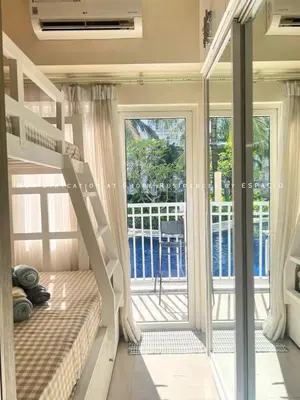 a bunk bed in a room with a balcony at Ezpacio in Manila