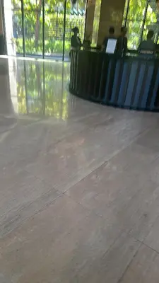 an empty mall with people sitting at a counter at Casa Delantera Karaoke Games Pet Friendly in Manila
