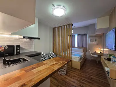 a small room with a kitchen and a bedroom at 1BR Suite Ridgewood Towers Near BGC Airport #RW17-1 in Manila