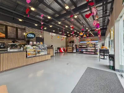 a grocery store aisle with a person in a store at 1BR Suite Ridgewood Towers Near BGC Airport #RW17-1 in Manila