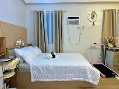 a hospital room with a bed and a shower at Auberge Condotels B at SMDC Hope Residences in Trece Martires