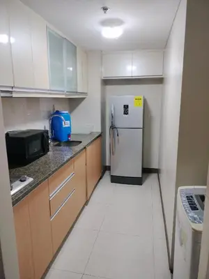 a kitchen with a refrigerator and a microwave at Rooms in Pasay City At Two Palm Tree Villas in Manila