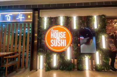 a sign on the window of a house of sushi at Netflix & Chill Stylish Makati condo gym swim park internet fast 2474 in Manila