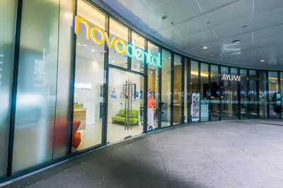 a store front of a shopping mall with a sign on the window at Netflix & Chill Stylish Makati condo gym swim park internet fast 2474 in Manila
