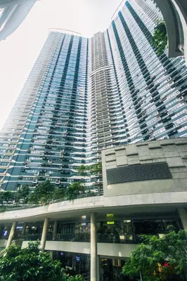 a large tall building with a lot of windows at The Kings Condo Luxury 1BR Makati Ayala Gym Swim Parking Fast Internet 3058 in Manila