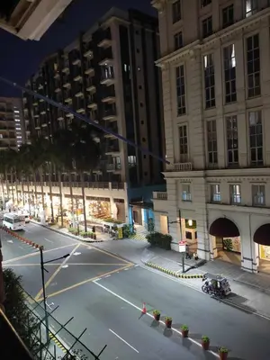 an empty street in a city at night at LDN Pinecrest Two-room Suite in Manila