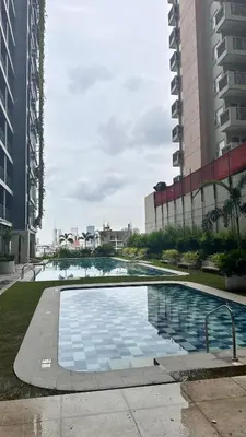 a swimming pool in a city with tall buildings at City Escape in Manila