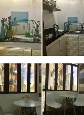 a kitchen with a sink and a table and a window at Makati City Private Studio across Greenbelt Mall in Manila
