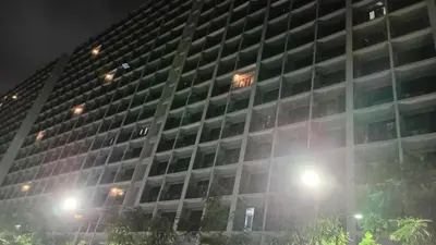 a tall building with a sign on it at night at Casa Via at Shore 2 Residences inside SM MOA Complex, Pasay City in Manila