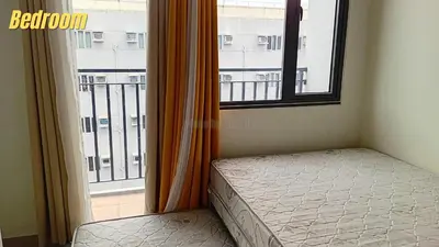 a bedroom with a bed and a window with a balcony at Casa Via at Shore 2 Residences inside SM MOA Complex, Pasay City in Manila