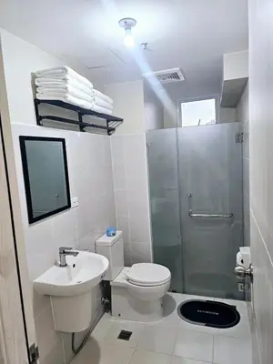 a bathroom with a toilet and a shower and a sink at Suntrus,t Solana Condominium - Ermita, Manila - SM Manila in Manila