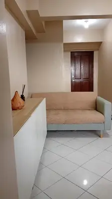 a living room with a couch in a room at BahayMandaragat2 in Manila