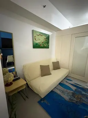a room with a white couch in a room at Bernie and Adel's Property Rental in Manila