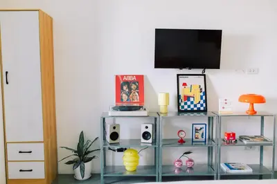 a glass shelf with a television on top of it at The Cube in Cubao in Quezon City