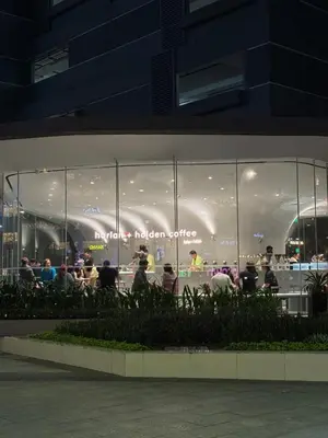 a large glass window of a store at night at ONE UPTOWN RESIDENCE BGC 2-bed 1BR in Manila