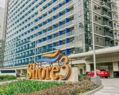 a sign in front of a large building at Mall of Asia shore 3 tower 2 residence in Manila