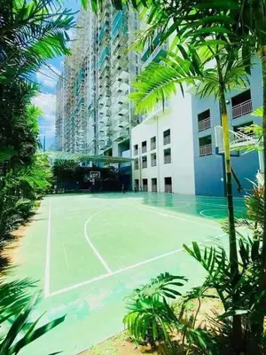 a tennis court in front of a building at B&C studio in Manila