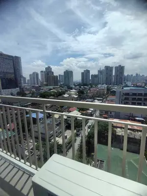 a view of a city from the balcony of a building at AHD Staycation in Manila