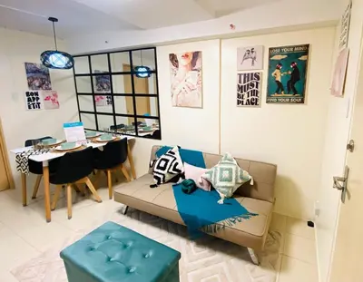 a living room with a couch and a table at 1Haven in Pasig CCF Bridgetown in Manila