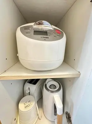 a toaster sitting on a shelf in a kitchen at Luxury staycation at prime location Mall of Asia Shell Residences Pasay Tower C in Manila
