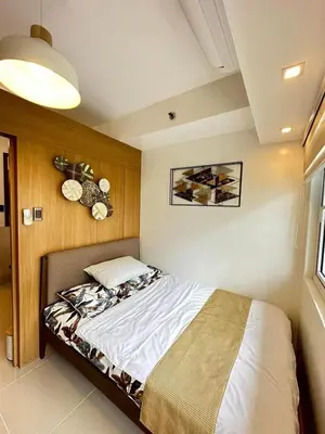 a bedroom with a bed in a room at Luxury staycation at prime location Mall of Asia Shell Residences Pasay Tower C in Manila