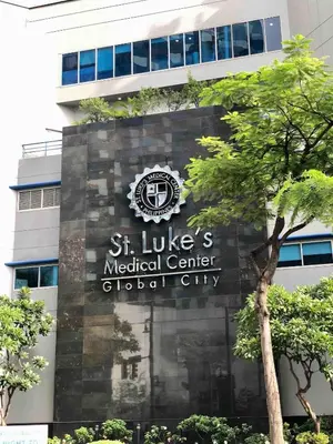 a sign for the st lucia medical center at Uptown Parksuites BGC Stylish 2BR Fast WiFi Washer Balcony in Manila
