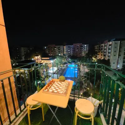 a chess board on a table on a balcony at 1BR Cozy Home with Balcony Near NAIA Terminals in Manila