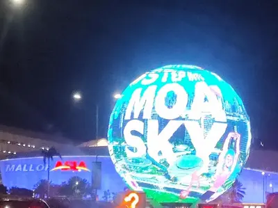 amber six sign is lit up in front of a balloon at All I Want Relax at Shore Residences in MOA Complex in Manila