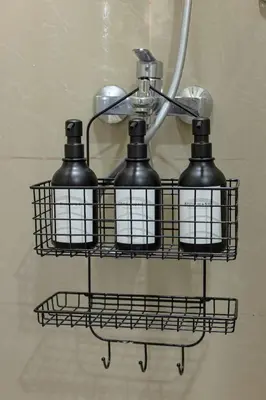 a shelf with two black bottles on a wall at Stylish 2 BR Home with Bathtub and Balcony Uptown BGC in Manila