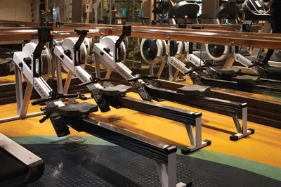 a row of empty benches in a gym at Julias Tropical Oasis Golf Skyline View in Manila