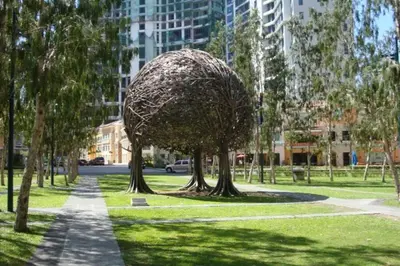 a sculpture of a tree in a park at Julias Attractive and Cozy Penthouse Golf View in Manila