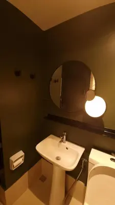 a bathroom with a sink and a mirror at Highwind - Projector, Playstation 4, Pool in Silang