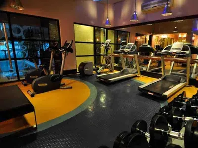 a gym with treadmills and elliptical machines at Elegant and Modern 2 BR Home Golf Skyline View in Manila
