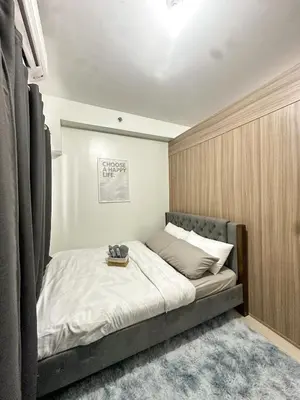a bedroom with a large bed with at The Hideout Condotel in Shore 2 Residences Tower 3 in Manila
