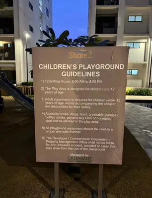 a sign for a childrens playground in front of a building at The Hideout Condotel in Shore 2 Residences Tower 3 in Manila