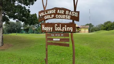 a sign that says navarre air base golf course at The Monochrome Nest in Manila