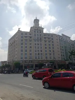 a large building with a clock tower on top of it at 150 Newport Boulevard in Manila