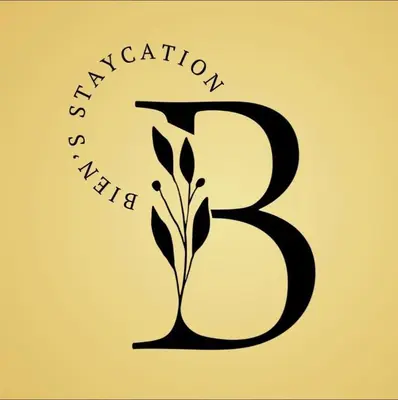 a black letter b with a plant in the middle at Biens Staycation at SHORE Residences near Mall of Asia in Manila