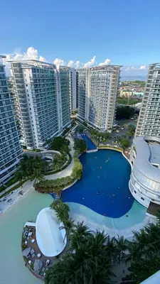 an aerial view of a resort with tall buildings at Azure Daily in Manila