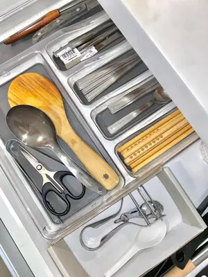 a drawer with scissors and other kitchen utensils at Azure Daily in Manila
