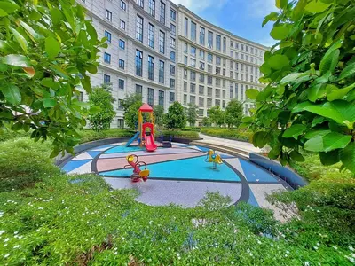 a playground in front of a large building at Naia T3 Condotel in Manila