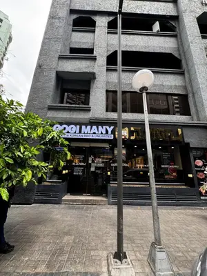 a street light in front of a building at Convertible Solo Budget Studio in Salcedo Village in Manila