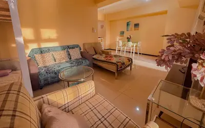 a living room with a couch and a table at The Radiance Manila bay 2BR in Manila