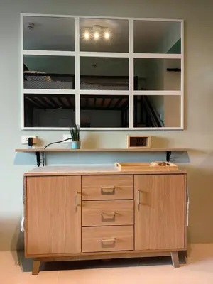 a desk in a office with a large mirror at Seaside Sanctuary and Beach Vibes in Manila
