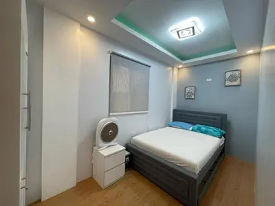 a small bedroom with a bed and a tv at Casa MiKulai