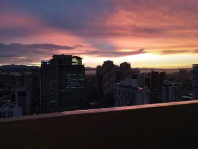 a view of a city skyline at sunset at EK's Place in Manila
