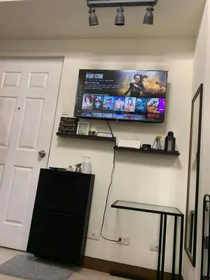 a room with a computer monitor on a wall at EK's Place in Manila